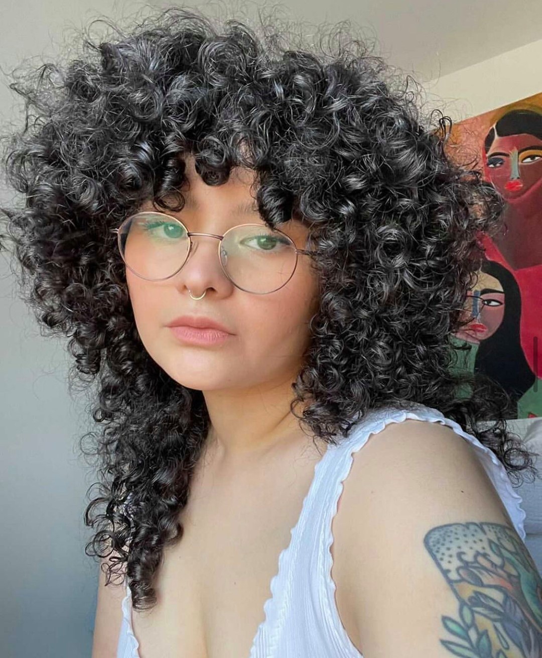 27. Shaggy Curly Haircut with Bangs