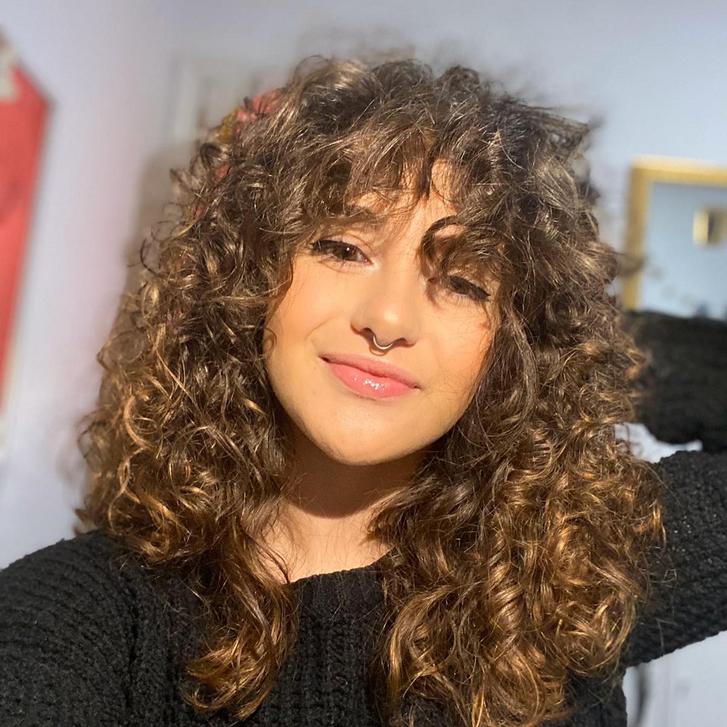 30. Shaggy Curly Hairstyle with Bangs