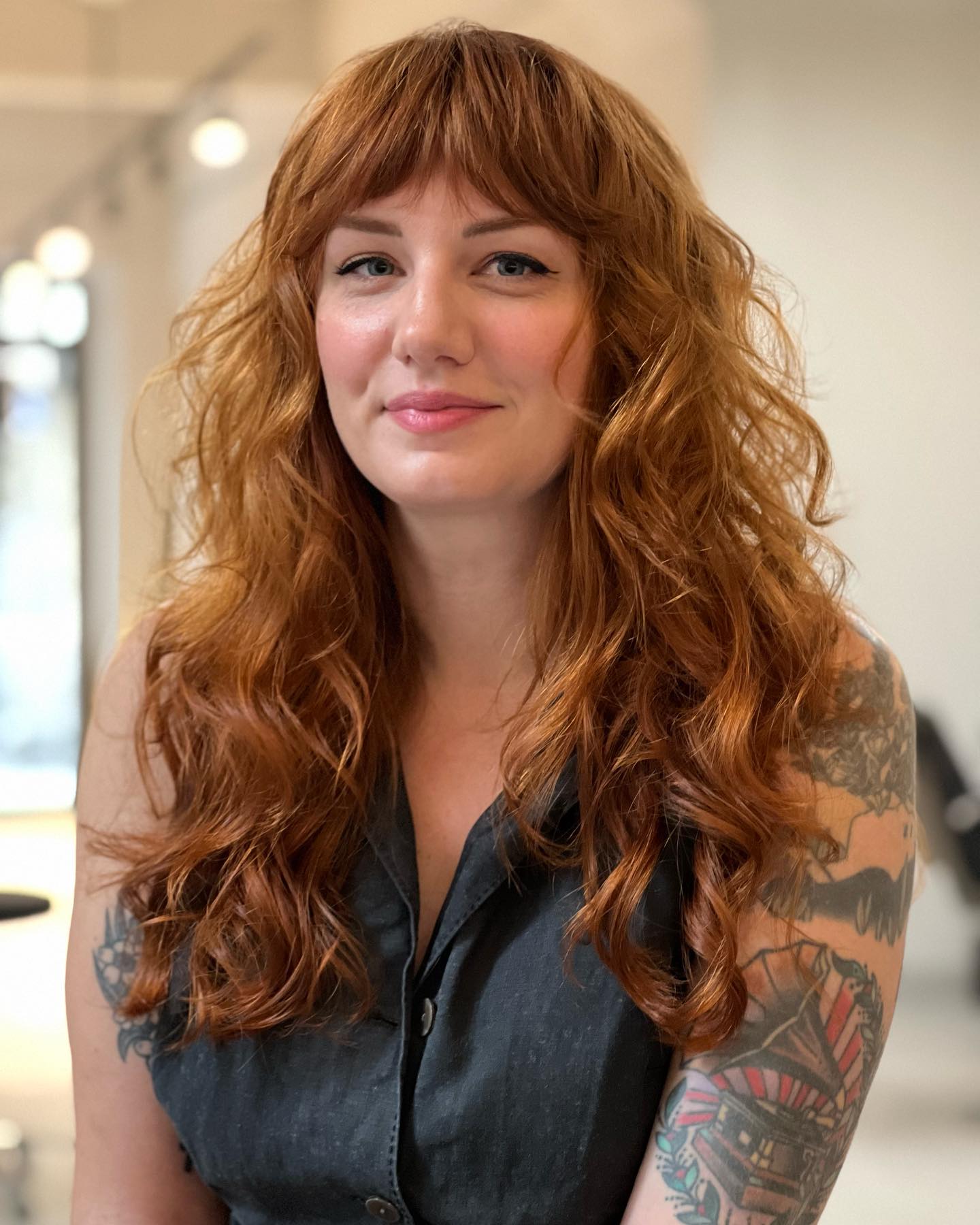 24. Shaggy Curly Hair with Bangs